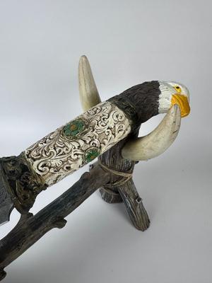 Exquisitely detailed carved 13” American eagle knife with 8” blade with antler stand