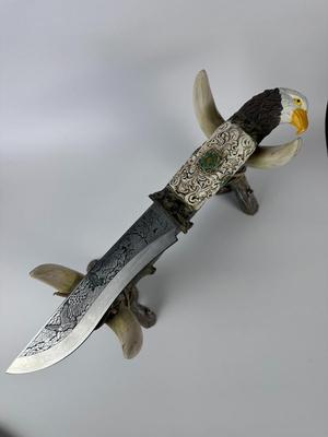 Exquisitely detailed carved 13” American eagle knife with 8” blade with antler stand