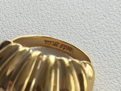 Gold tone marked fashion ring