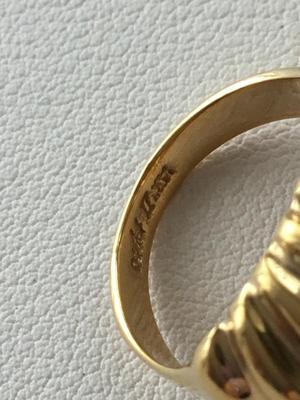 Gold tone marked fashion ring