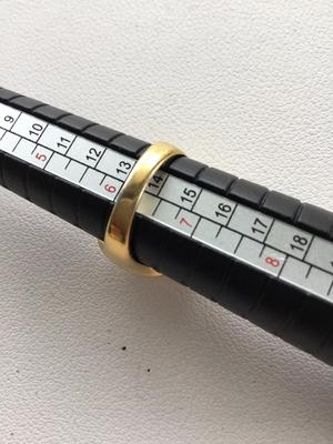 Gold tone marked fashion ring