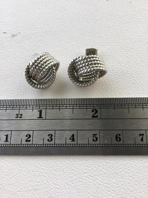 Unmarked silver tone knot stud earrings