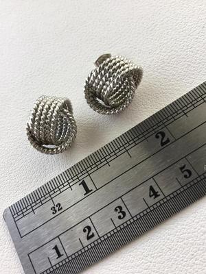 Unmarked silver tone knot stud earrings