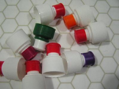 Campers & hikers water bottle and some nipple style bottle caps.