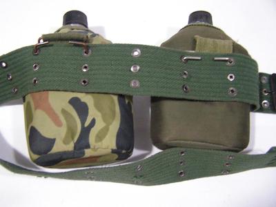 Pair of G.I. style canteens with belt pouches and belt. Good condition