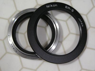 Nikon macro adapter ring set (aka: lens reversing ring set). PNs: BR-2A & BR-5,