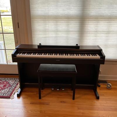 L1200 Yamaha Electric Piano with Sheet Music