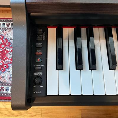 L1200 Yamaha Electric Piano with Sheet Music