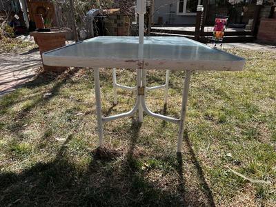 GLASS TOP PATIO TABLE AND AN UMBRELLA