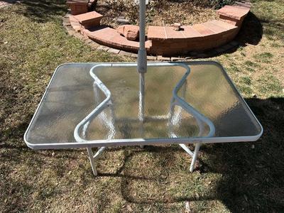 GLASS TOP PATIO TABLE AND AN UMBRELLA