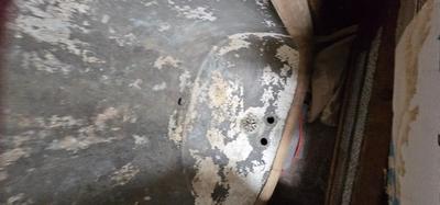 Antique tin bathtub with wood on the edge