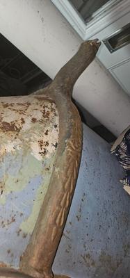 Antique tin bathtub with wood on the edge