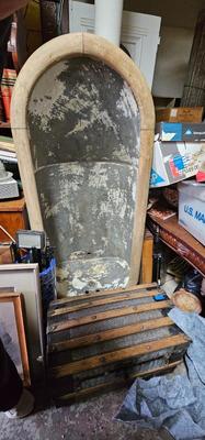 Antique tin bathtub with wood on the edge