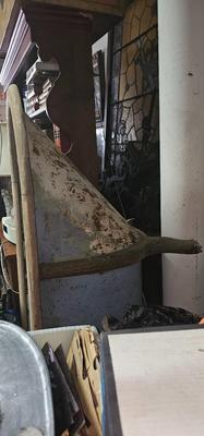 Antique tin bathtub with wood on the edge