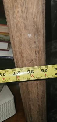 Antique tin bathtub with wood on the edge