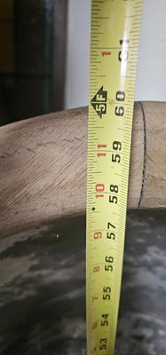 Antique tin bathtub with wood on the edge