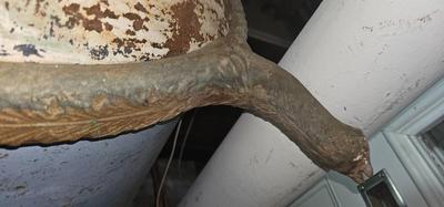 Antique tin bathtub with wood on the edge