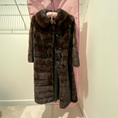 Sale Photo Thumbnail #395: Brown mink coat with cover 
Sleeves are short and 3/4 length size small (6-8) 
Very good condition