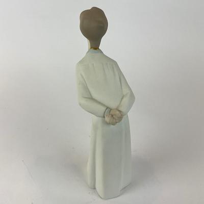 L1305 Lladro Boy Leaning over Kissing Figurine