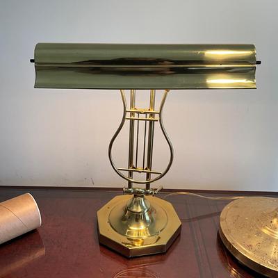 Sale Photo Thumbnail #784: Brass floor lamp has shell shaped shade and is adjustable 35" high at lowest  
Brass desk lamp has two bulbs and can be adjusted 16" high x 14" wide