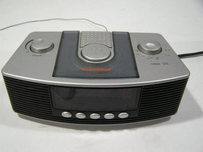 Do you hear that? SYLVANIA alarm clock radio. AM/FM/alarm/snooze/sleep.