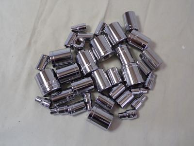 An assortment of small sockets, 1/4” drive and 3/8” drive. WYSIWYG