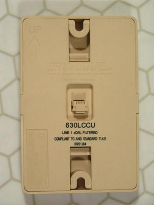 Shuttle brand phone line conditioner for DSL to a wall mount phone