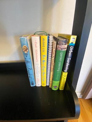 5 TIER LADDER SHELF WITH AN ASSORTMENT OF BOOKS