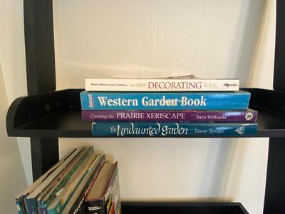 5 TIER LADDER SHELF WITH AN ASSORTMENT OF BOOKS