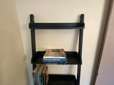 5 TIER LADDER SHELF WITH AN ASSORTMENT OF BOOKS