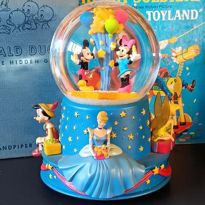 LOT 336: Disney Golden Books 'Donald Duck and the Christmas Carol', Verichron Mickie & Minnie Clock, Hallmark 100th...