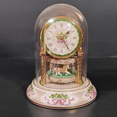 LOT 390: The Franklin Mint Carousel Clock, Danny Boy Poem Music Box Frame & 'The Irish' Coffee Table Book