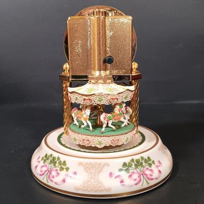 LOT 390: The Franklin Mint Carousel Clock, Danny Boy Poem Music Box Frame & 'The Irish' Coffee Table Book