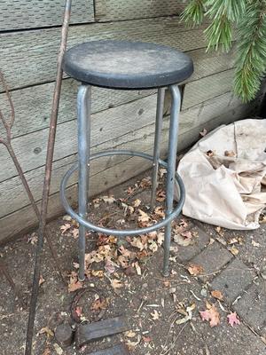 IRON WEDGES, RUSTIC LOOKING FORKS, A HORSE SHOE AND A BAR STOOL