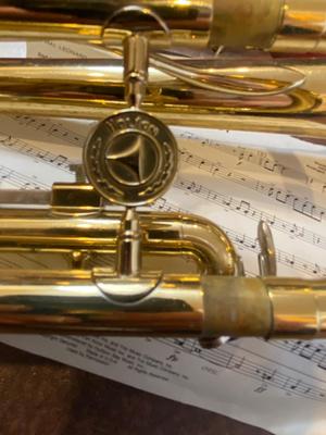HOLTON BRASS TRUMPET WITH CASE, SLIDE OIL, MUSIC AND PINK LYRE