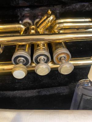 HOLTON BRASS TRUMPET WITH CASE, SLIDE OIL, MUSIC AND PINK LYRE