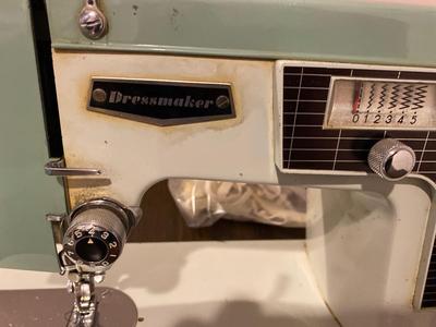 VINTAGE DRESSMAKERS SEWING MACHINE IN CABINET WITH SEWING NOTIONS AND MORE