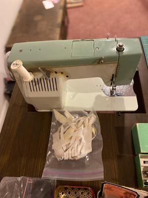 VINTAGE DRESSMAKERS SEWING MACHINE IN CABINET WITH SEWING NOTIONS AND MORE