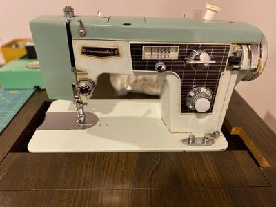 VINTAGE DRESSMAKERS SEWING MACHINE IN CABINET WITH SEWING NOTIONS AND MORE