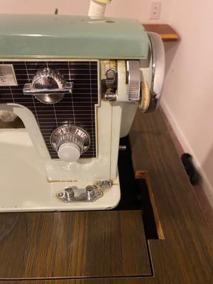 VINTAGE DRESSMAKERS SEWING MACHINE IN CABINET WITH SEWING NOTIONS AND MORE