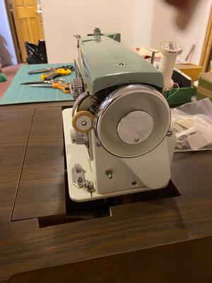 VINTAGE DRESSMAKERS SEWING MACHINE IN CABINET WITH SEWING NOTIONS AND MORE