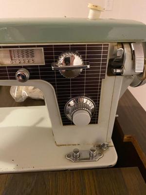 VINTAGE DRESSMAKERS SEWING MACHINE IN CABINET WITH SEWING NOTIONS AND MORE