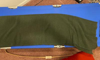 BOW, SLEEPING COT, WOOL BLANKET, FLEECE BLANKET, INFLATABLE SLEEPING PAD, AND A SONG BOOK FOR SINGING WHILE YOU CAMP!