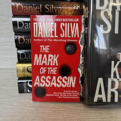 LOT 209L: Daniel Silva Novel Collection incl. 2004 Signed Copy of “A Death in Vienna”