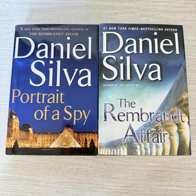 LOT 209L: Daniel Silva Novel Collection incl. 2004 Signed Copy of “A Death in Vienna”
