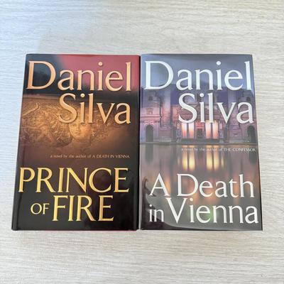 LOT 209L: Daniel Silva Novel Collection incl. 2004 Signed Copy of “A Death in Vienna”