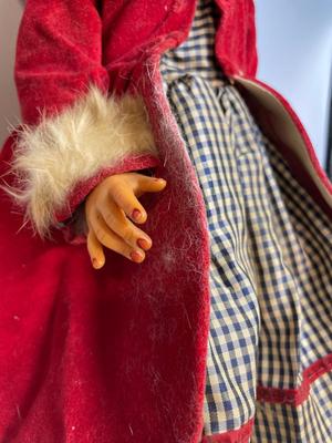 Vintage doll in red velvet jacket