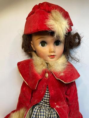 Vintage doll in red velvet jacket