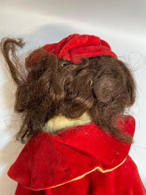 Vintage doll in red velvet jacket