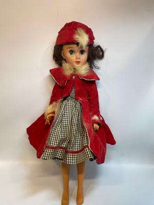 Vintage doll in red velvet jacket